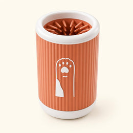 Coathaus Paw Cleaner Cup in warm clay, showing the ribbed body and paw emblem
