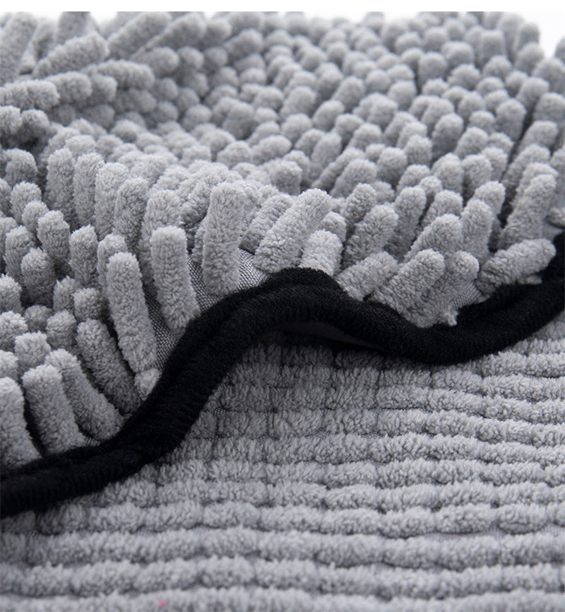 Close-up of the chenille pile and bound black edge of the Coathaus pet drying towel