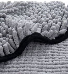 Close-up of the chenille pile and bound black edge of the Coathaus pet drying towel