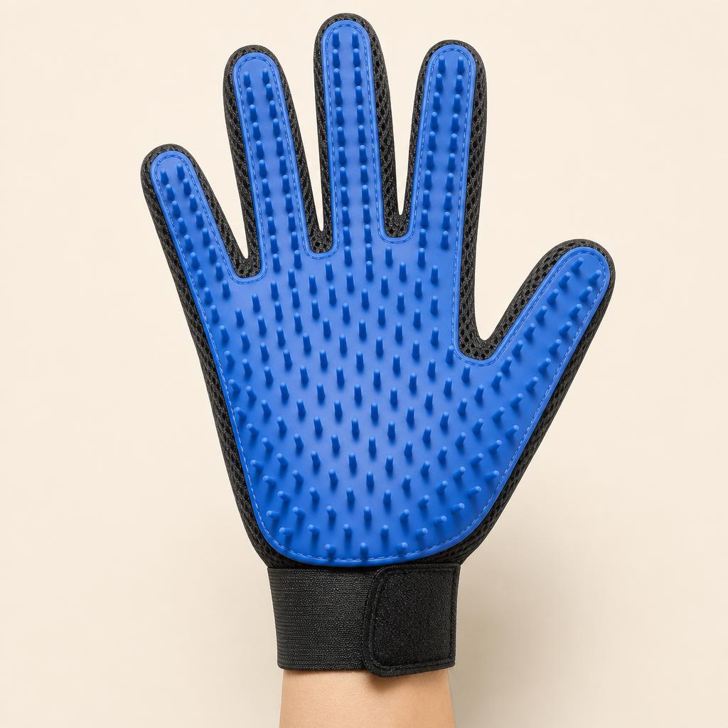 Hand wearing the Coathaus grooming glove, palm facing forward showing the long silicone pins