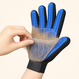 Pet fur caught between the long silicone pins of the Coathaus glove, being peeled off in one sheet